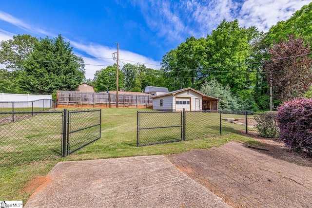 view of yard with a gate and a garage