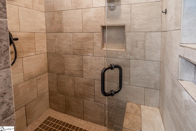 full bathroom featuring a shower stall