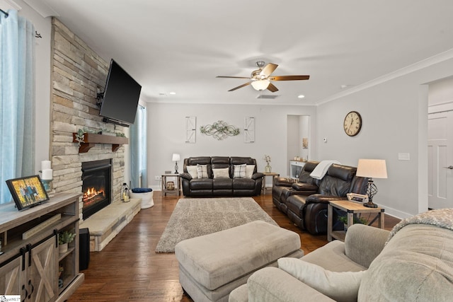 916 Lockhurst Dr, Simpsonville, SC 29681 - living room featuring a ceiling fan, dark wood-style flooring, ornamental molding, a stone fireplace, and recessed lighting