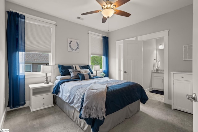 916 Lockhurst Dr, Simpsonville, SC 29681 - carpeted bedroom with connected bathroom, baseboards, and ceiling fan