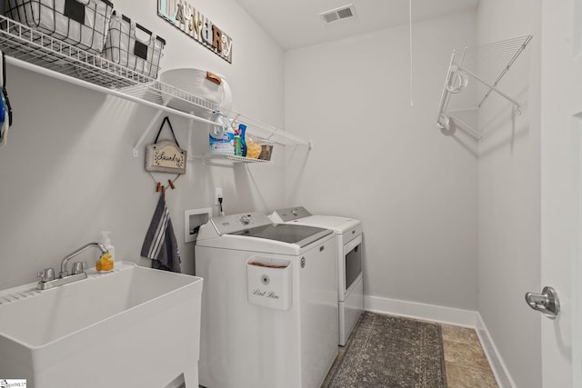 916 Lockhurst Dr, Simpsonville, SC 29681 - laundry area featuring washing machine and dryer and baseboards
