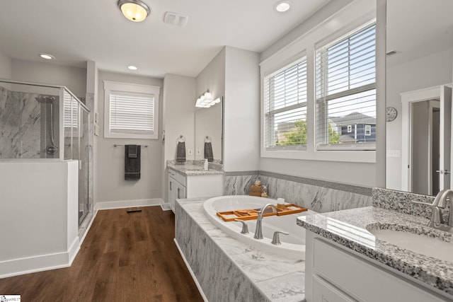 916 Lockhurst Dr, Simpsonville, SC 29681 - full bath with a stall shower, a bath, baseboards, wood finished floors, and recessed lighting