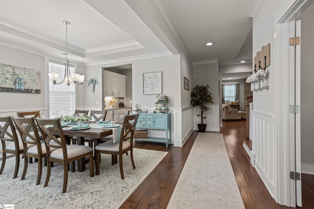 916 Lockhurst Dr, Simpsonville, SC 29681 - dining space with plenty of natural light, dark wood-style flooring, a chandelier, wainscoting, and a decorative wall