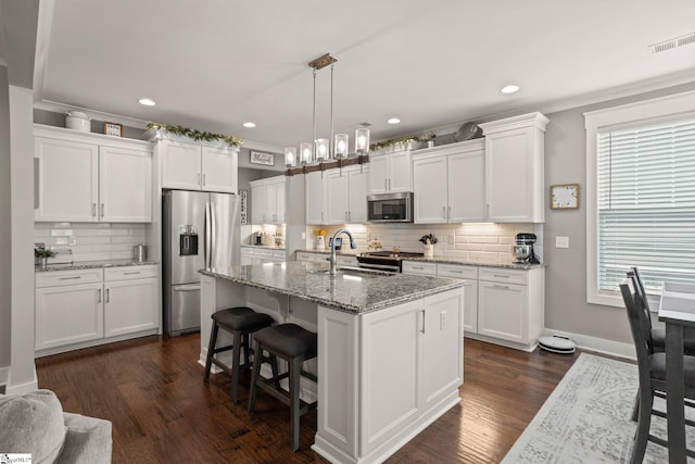 916 Lockhurst Dr, Simpsonville, SC 29681 - kitchen with stainless steel appliances, a sink, decorative backsplash, white cabinetry, and recessed lighting