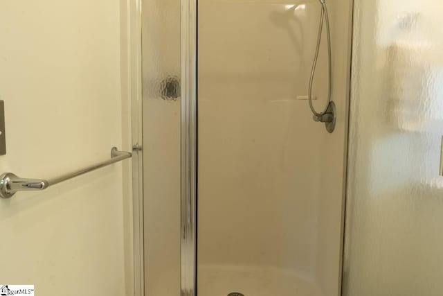 bathroom with a stall shower