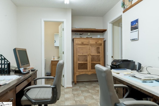 home office with a textured ceiling