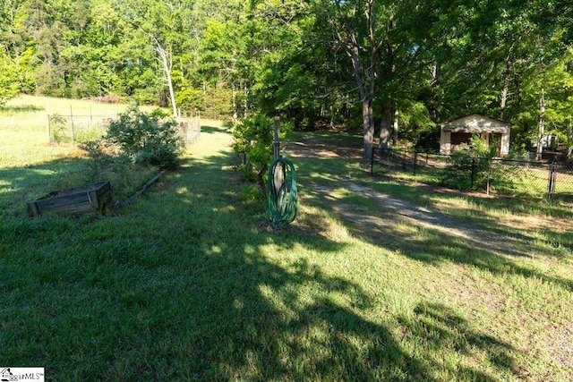 view of yard with a wooded view