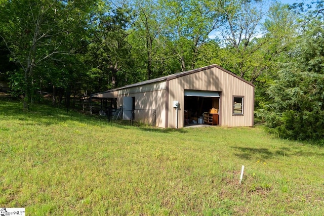view of pole building with a lawn
