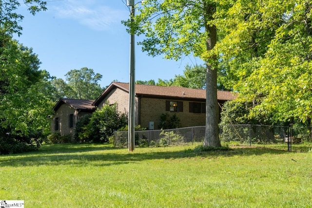 view of side of property featuring brick siding