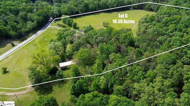 overview of rural landscape featuring property boundaries highlighted and a forest
