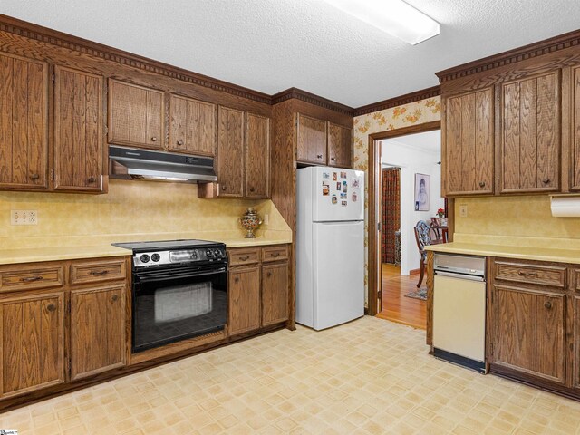 132 Rosecrest Rd, Spartanburg, SC 29303 - kitchen with freestanding refrigerator, under cabinet range hood, black range with electric cooktop, light floors, and light countertops