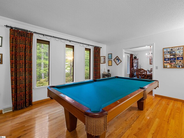 132 Rosecrest Rd, Spartanburg, SC 29303 - game room featuring a textured ceiling, pool table, light wood finished floors, baseboards, and a chandelier