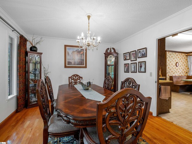 132 Rosecrest Rd, Spartanburg, SC 29303 - dining area with light wood-type flooring, a chandelier, ornamental molding, baseboards, and a textured ceiling