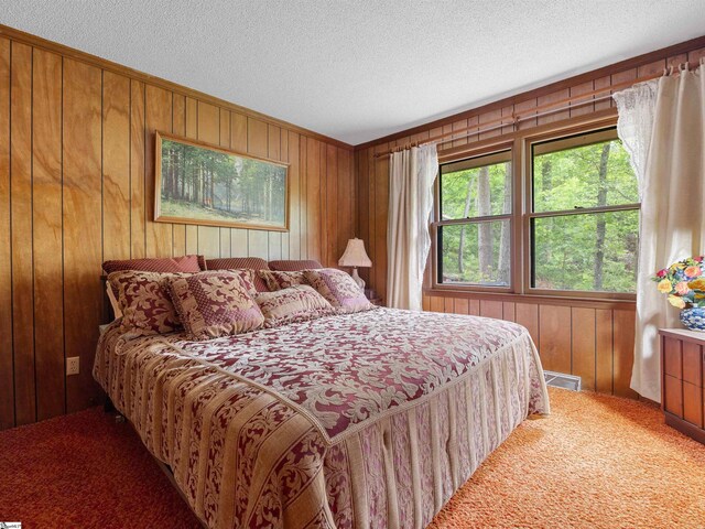 132 Rosecrest Rd, Spartanburg, SC 29303 - carpeted bedroom with wood walls and a textured ceiling