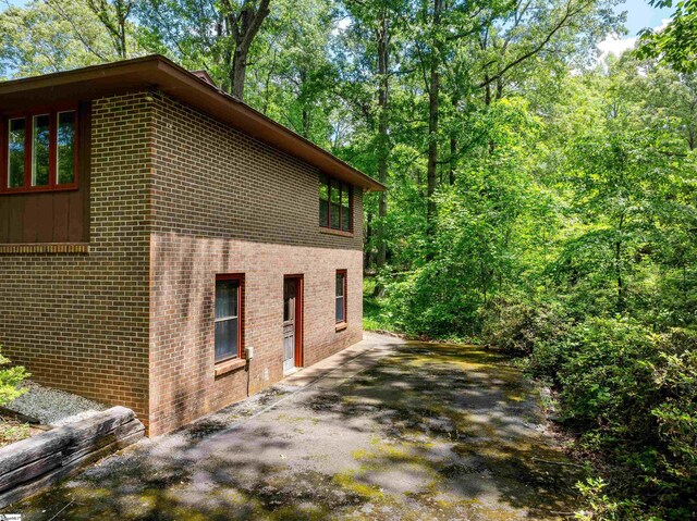 132 Rosecrest Rd, Spartanburg, SC 29303 - view of home's exterior with brick siding and a patio