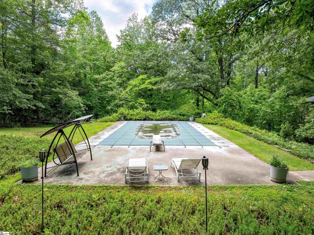 132 Rosecrest Rd, Spartanburg, SC 29303 - view of swimming pool featuring a patio, a covered pool, and a view of trees