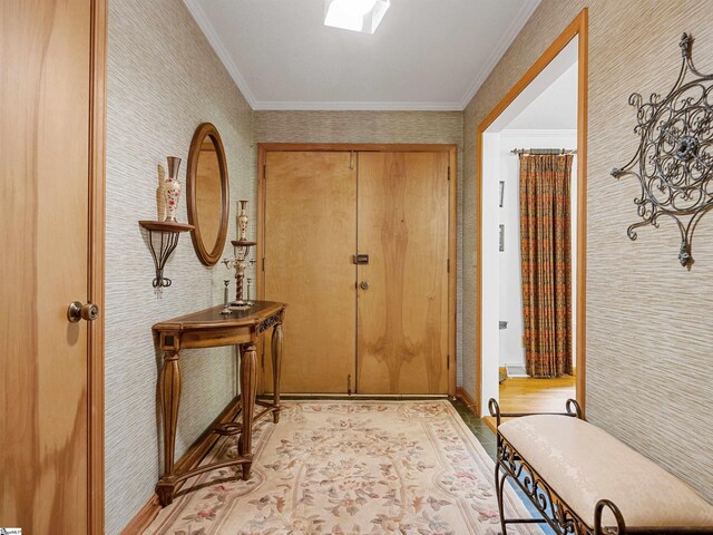 132 Rosecrest Rd, Spartanburg, SC 29303 - doorway with wallpapered walls, ornamental molding, baseboards, and light wood-style floors