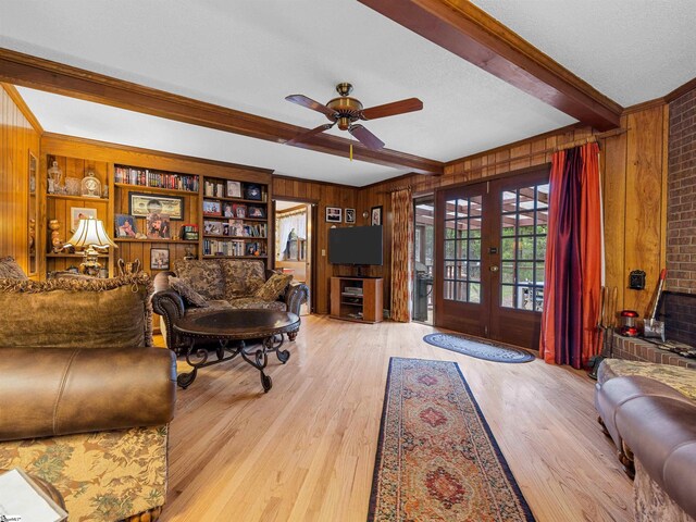 132 Rosecrest Rd, Spartanburg, SC 29303 - living room featuring wood walls, french doors, beam ceiling, wood finished floors, and ceiling fan