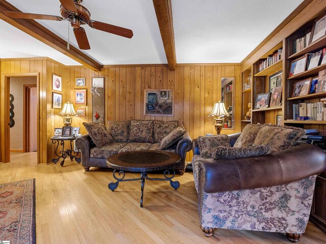 132 Rosecrest Rd, Spartanburg, SC 29303 - living room with beamed ceiling, ceiling fan, wooden walls, and wood finished floors