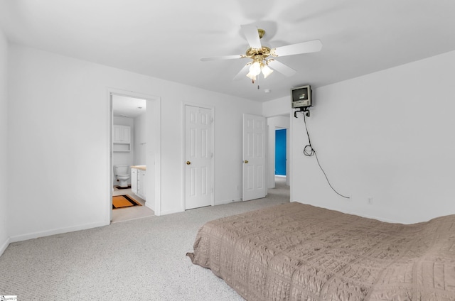 477 Perry Rd, Greer, SC 29651 - carpeted bedroom featuring baseboards, ensuite bathroom, and a ceiling fan