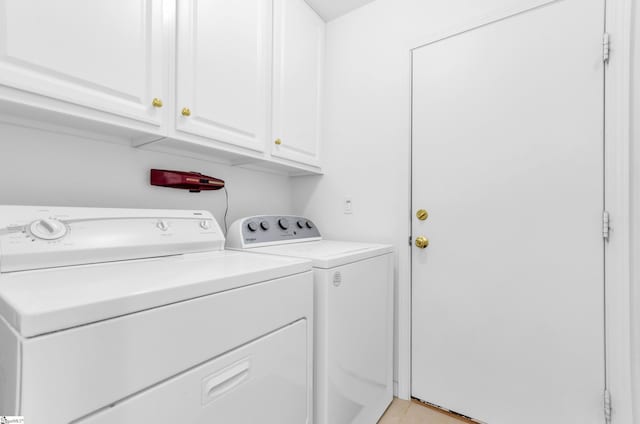 477 Perry Rd, Greer, SC 29651 - laundry area featuring washer and dryer, cabinet space, and light tile patterned flooring