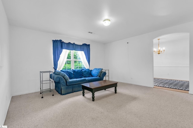 477 Perry Rd, Greer, SC 29651 - living area featuring arched walkways, carpet floors, a chandelier, and baseboards