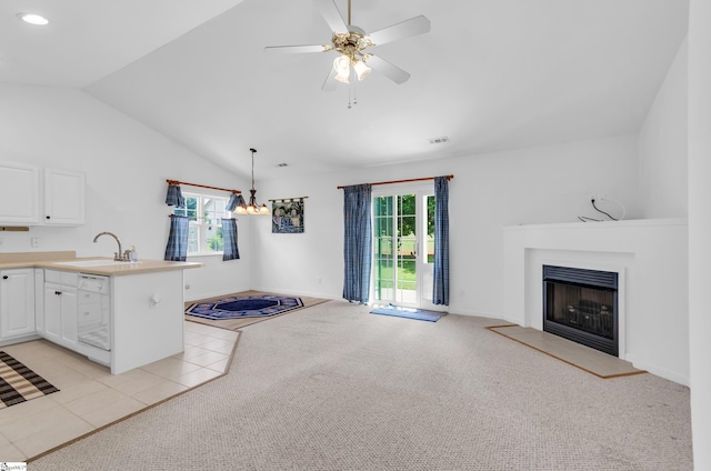 477 Perry Rd, Greer, SC 29651 - kitchen with a sink, a peninsula, white dishwasher, a fireplace with raised hearth, and open floor plan