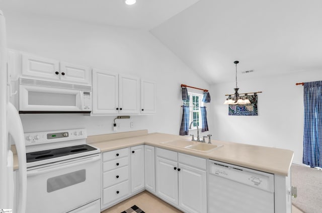 477 Perry Rd, Greer, SC 29651 - kitchen with white appliances, a sink, a peninsula, vaulted ceiling, and a chandelier
