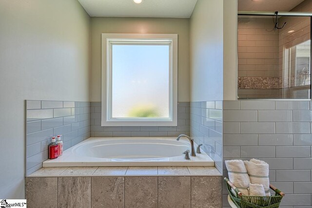 2007 Edwards Lake Rd, Greer, SC 29651 - bathroom featuring a stall shower and a garden tub