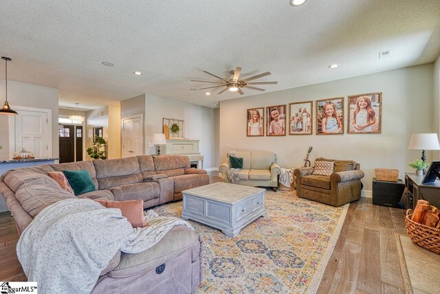 2007 Edwards Lake Rd, Greer, SC 29651 - living room featuring light wood-style flooring, a textured ceiling, ceiling fan, recessed lighting, and baseboards