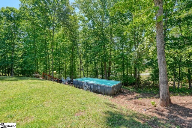 2007 Edwards Lake Rd, Greer, SC 29651 - view of grassy yard featuring an outdoor pool