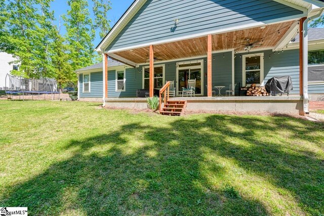2007 Edwards Lake Rd, Greer, SC 29651 - back of house with a trampoline and a yard