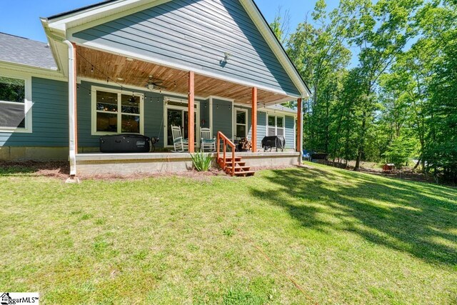 2007 Edwards Lake Rd, Greer, SC 29651 - rear view of property with ceiling fan, a yard, and a porch