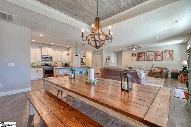 2007 Edwards Lake Rd, Greer, SC 29651 - dining room featuring ceiling fan, a chandelier, hardwood / wood-style floors, recessed lighting, and baseboards