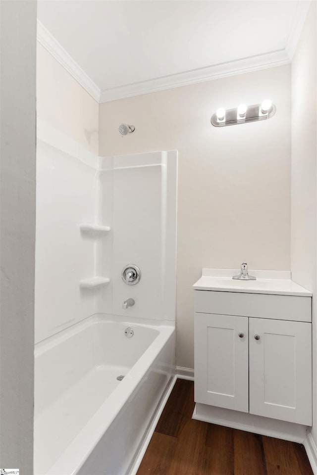 128 Owens St, Spartanburg, SC 29306 - bathroom featuring ornamental molding, wood finished floors, vanity, baseboards, and tub / shower combination