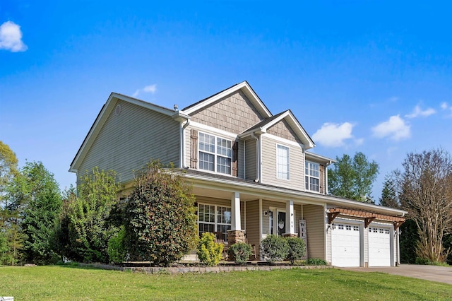 craftsman-style home with a porch, a front yard, driveway, and a garage