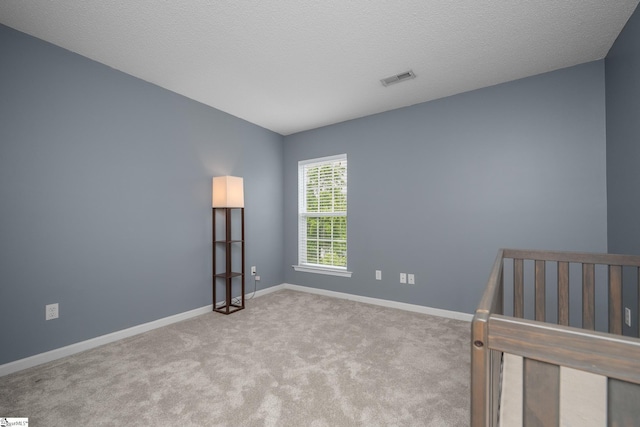 unfurnished bedroom featuring carpet and baseboards