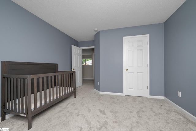 bedroom featuring carpet flooring and baseboards