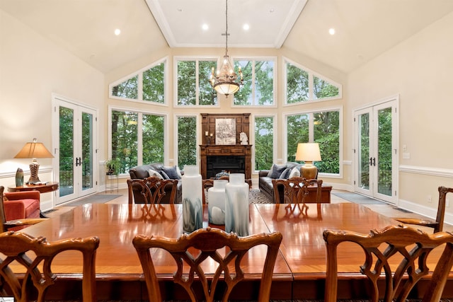 201 King Eider Way, Taylors, SC 29687 - dining area with french doors, high vaulted ceiling, a warm lit fireplace, recessed lighting, and baseboards
