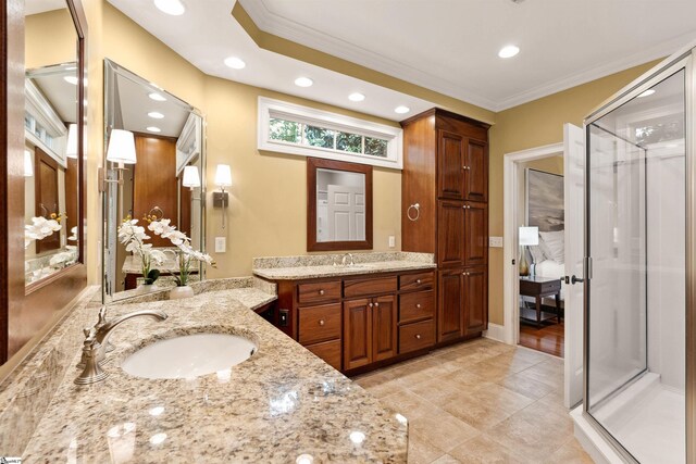 201 King Eider Way, Taylors, SC 29687 - bathroom with ornamental molding, two vanities, a shower stall, recessed lighting, and tile patterned floors