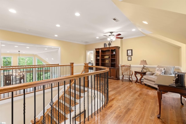 201 King Eider Way, Taylors, SC 29687 - hall featuring an upstairs landing, recessed lighting, light wood-style flooring, and crown molding