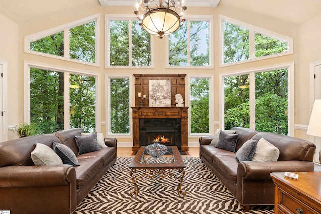 201 King Eider Way, Taylors, SC 29687 - living room with a towering ceiling, healthy amount of natural light, and a lit fireplace