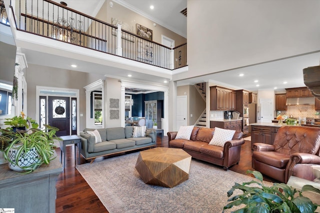 100 Bent Willow Way, Easley, SC 29642 - living area with stairway, dark wood-style floors, a towering ceiling, ornamental molding, and recessed lighting