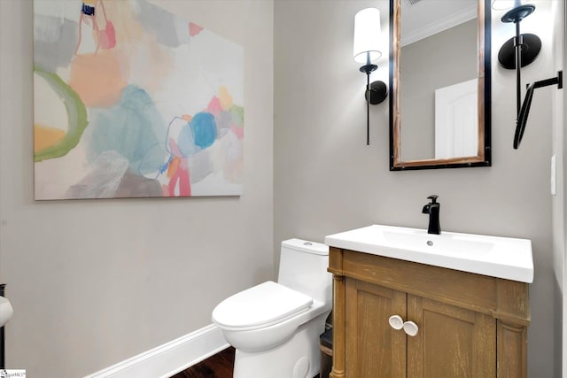 100 Bent Willow Way, Easley, SC 29642 - half bathroom featuring crown molding, vanity, toilet, baseboards, and wood finished floors