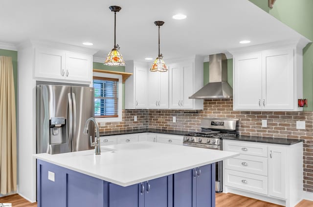 130 Windjammer Way, Anderson, SC 29626 - kitchen with wall chimney exhaust hood, appliances with stainless steel finishes, white cabinets, tasteful backsplash, and blue cabinets