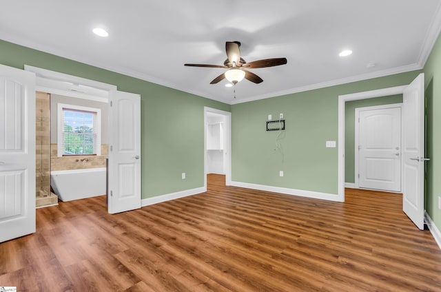 130 Windjammer Way, Anderson, SC 29626 - unfurnished bedroom with wood finished floors, a spacious closet, baseboards, crown molding, and ensuite bathroom