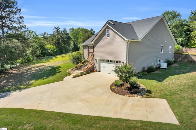 130 Windjammer Way, Anderson, SC 29626 - view of side of home featuring stairway, driveway, an attached garage, cooling unit, and a shingled roof
