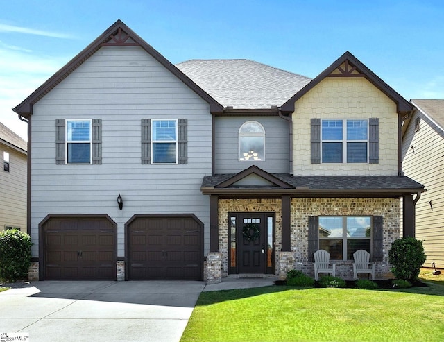 706 Airdale Ln, Simpsonville, SC 29680 - view of front of home with a garage, a front yard, driveway, a shingled roof, and covered porch