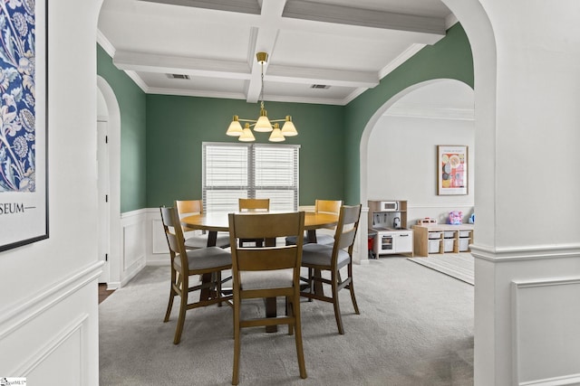 706 Airdale Ln, Simpsonville, SC 29680 - carpeted dining space with a chandelier, arched walkways, coffered ceiling, beamed ceiling, and ornamental molding