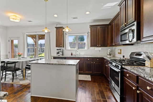 706 Airdale Ln, Simpsonville, SC 29680 - kitchen featuring appliances with stainless steel finishes, dark wood-style flooring, a sink, light stone counters, and recessed lighting